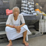 Old lady outside temple