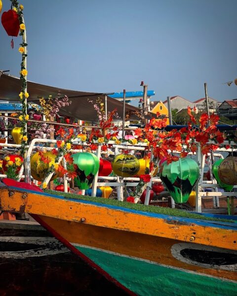 Colourful lanterns decorating boats in Hoi An