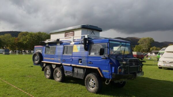 VW campervans at Busfest 2025 with Malvern Hills backdrop