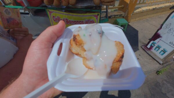 Grilled banana with coconut milk snack during Mekong River cruise Vietnam