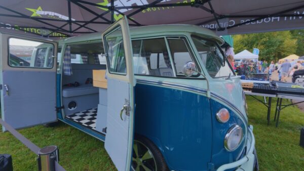 Classic VW campervan on display at a motorhome show