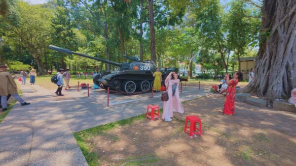Locals in traditional dress at Reunification Palace Vietnam