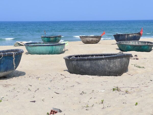Traditional Vietnamese round fishing boats on the beach