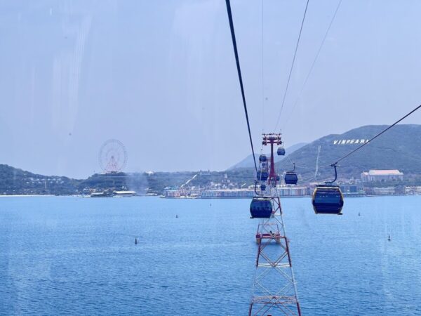 View from cable car overlooking Vinpearl Island, with ferris wheel in the distance