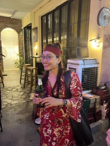 Friends enjoying drinks and food in Hoi An nightlife