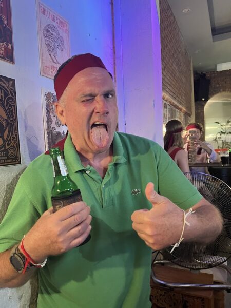 Friends enjoying drinks and food in Hoi An nightlife